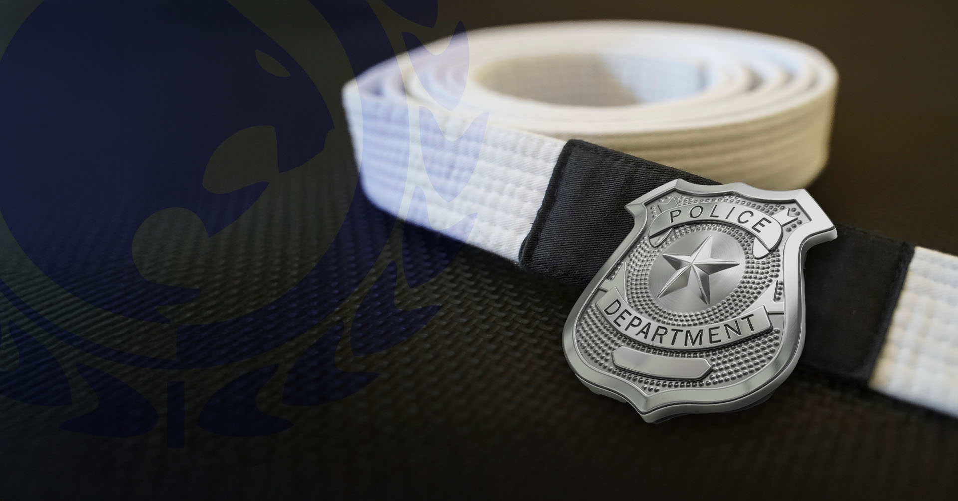 Police badge on BJJ belt Combatives for Cops and Renzo Gracie Clarksville LEO program