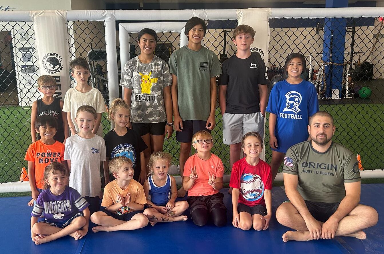 Professor CJ Garza (BJJ) joins some members of his Homeschool BJJ class for a photo. Photo by Jada Hoskins/Renzo Gracie Clarksville
